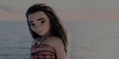 A Doll Is Standing On The Beach Near The Ocean . GIF