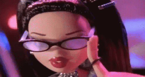 A Doll Wearing Glasses And Red Lips Is Blowing A Kiss . GIF