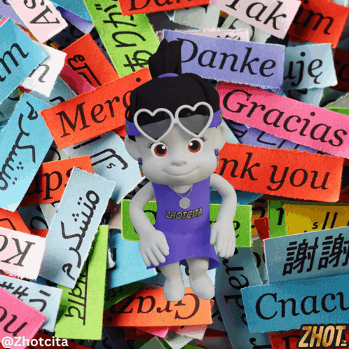 A Doll Wearing Sunglasses And A Zhotcita Shirt Stands In Front Of A Pile Of Colorful Stickers GIF
