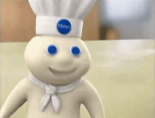 A Doll With Blue Eyes And A Chef 'S Hat GIF