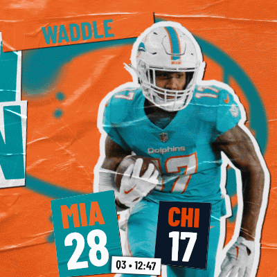 A Dolphins Football Player Named Waddle Is Running With A Ball GIF