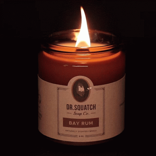 A Dr. Squatch Bay Rum Candle Is Lit Up GIF