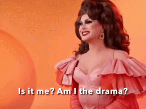 A Drag Queen In A Pink Dress Is Asking Is It Me Am I The Drama . GIF