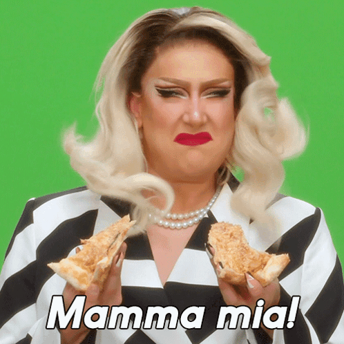 A Drag Queen Is Holding Two Slices Of Pizza With The Words Mamma Mia Written Above Her GIF