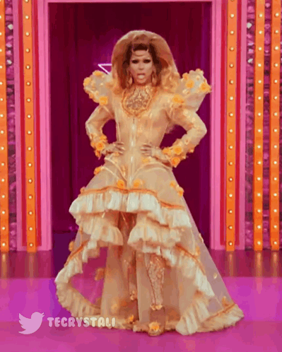 Drag Queen In Gold And White Dress Stage GIF