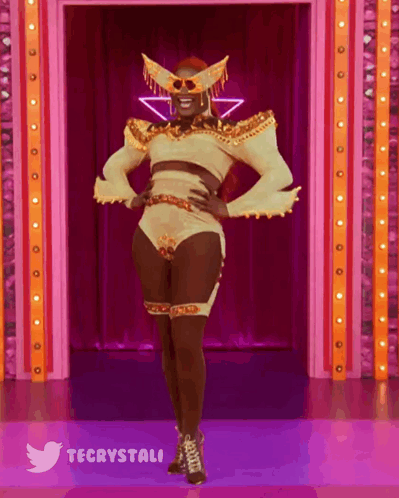 Drag Queen On Stage Wearing Mask GIF