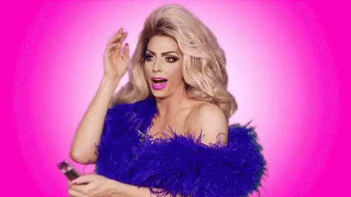 A Drag Queen Is Wearing A Blue Feather Boa And Holding A Phone . GIF