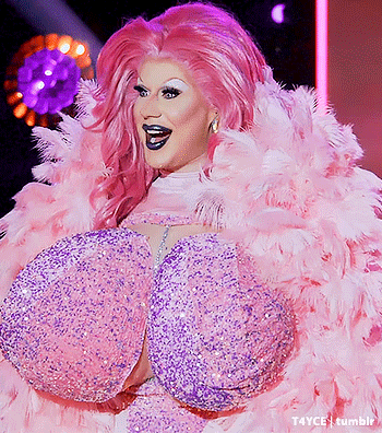 Drag Queen In Pink And Purple Feathered Outfit GIF