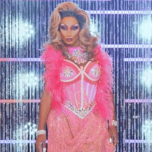 Drag Queen Wearing Pink Corset And Feather Boa GIF