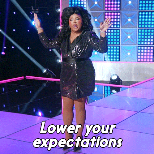 Drag Queen On Stage With Lower Your Expectations GIF