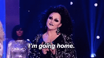 A Drag Queen Says I 'M Going Home While Holding A Microphone GIF