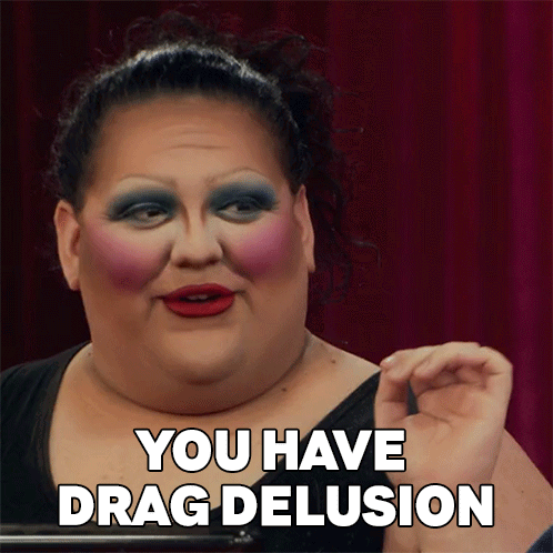 A Drag Queen Says " You Have Drag Delusion " In Front Of Her Face GIF
