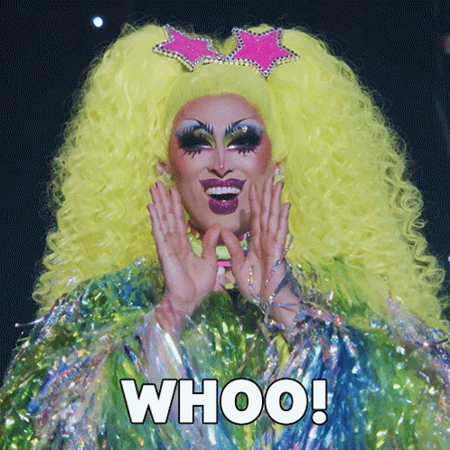 A Drag Queen With A Yellow Wig And A Pink Star On Her Head Says " Whoo " GIF