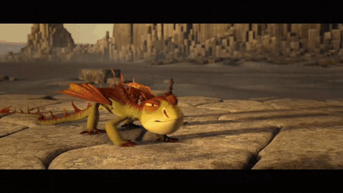 A Dragon From How To Train Your Dragon Is Crawling On A Rock GIF