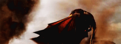 A Dragon Is Flying Through A Cloudy Sky With Smoke Coming Out Of It 'S Mouth . GIF