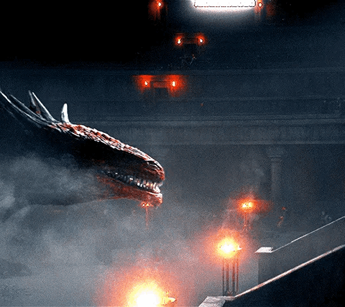 A Dragon Is Flying Through The Air In A Dark Room With A Sign That Says ' A ' On It GIF