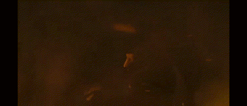 A Dragon Is Flying Through The Air With Flames Coming Out Of It 'S Mouth GIF