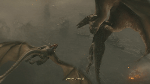 a dragon is flying through the air with flames coming out of it 's mouth