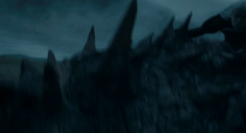 a dragon is flying through the air with its wings outstretched