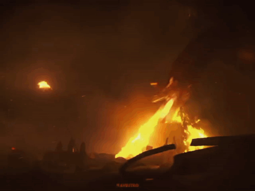 A Dragon Is Surrounded By Flames And A Sign That Says " Ravaging " GIF