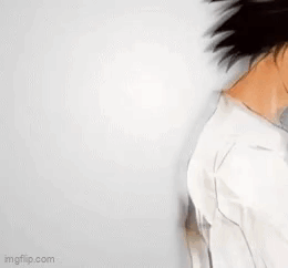 A Drawing Of A Man With Long Black Hair And A White Shirt . GIF