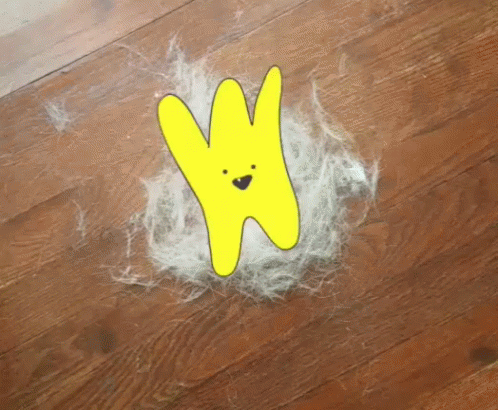 A Drawing Of A Yellow Bunny With A Face Is On The Floor GIF