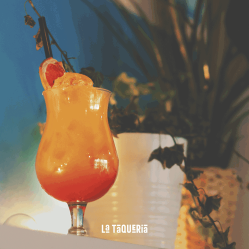 A Drink In A Glass With La Taqueria Written On It GIF