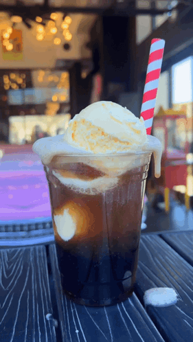 A Drink With Ice Cream And A Striped Straw GIF