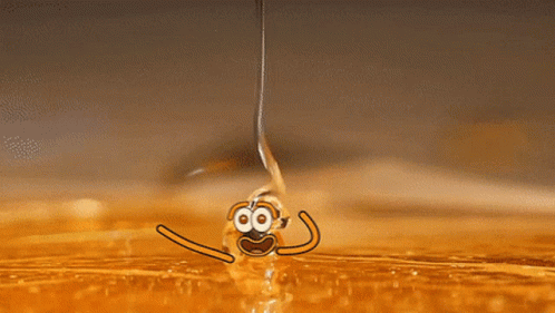 A Drop Of Liquid Is Being Poured Into A Container GIF