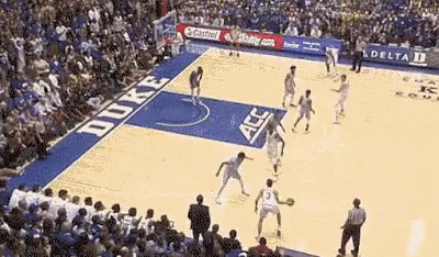 a duke basketball game is being played in front of a huge crowd