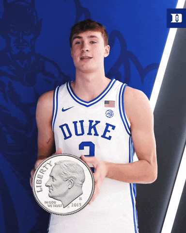 A Duke Basketball Player Holds A Liberty Coin GIF