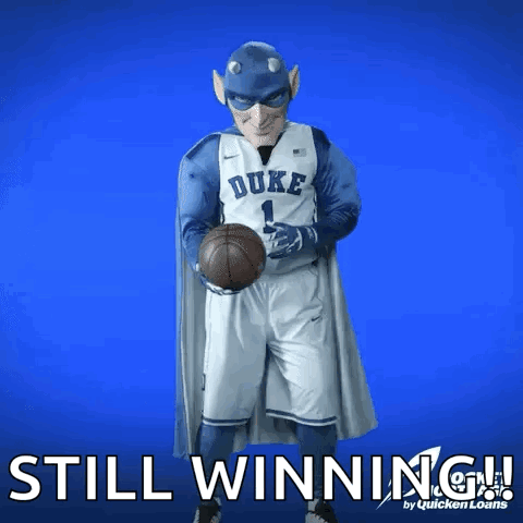 A Duke Basketball Player Is Holding A Basketball In His Hands GIF