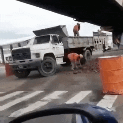 Dump Truck With Man Standing On Top GIF
