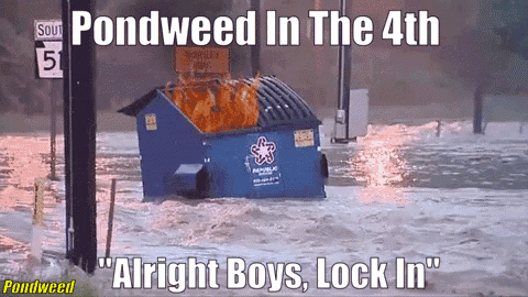A Dumpster Is On Fire In A Flooded Area With The Caption " Pondweed In The 4Th " GIF