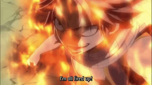 A Fairy Tail Character Says " I 'M All Fired Up " GIF