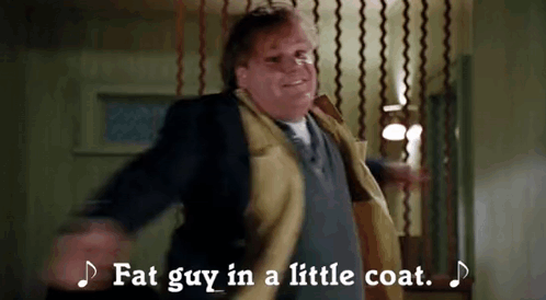 A Fat Guy In A Little Coat Is Dancing In A Room . GIF