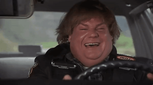 A Fat Man Is Driving A Car And Laughing . GIF
