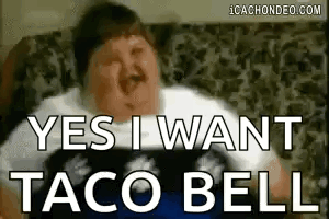 A Fat Man Is Sitting On A Couch With His Eyes Closed And Says `` Yes I Want Taco Bell '' . GIF