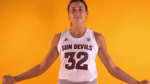 a female basketball player for the sun devils is flexing her muscles