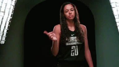 A Female Basketball Player Wearing A Black Jersey With The Number 20 On It GIF
