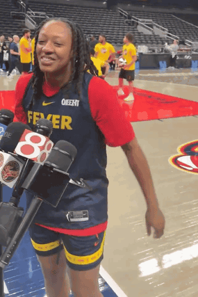 A Female Basketball Player Wearing A Fever Jersey GIF