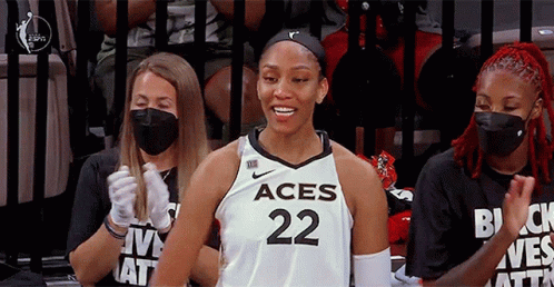 A Female Basketball Player Wearing A Jersey That Says Aces 22 GIF