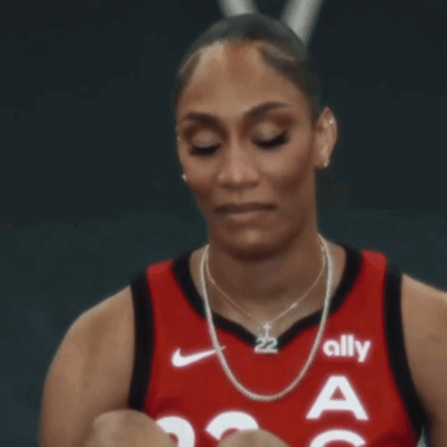 A Female Basketball Player Wearing A Jersey That Says Ally On It GIF