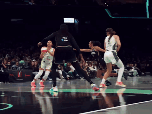 A Female Basketball Player Wearing A Jersey That Says At & T On It GIF