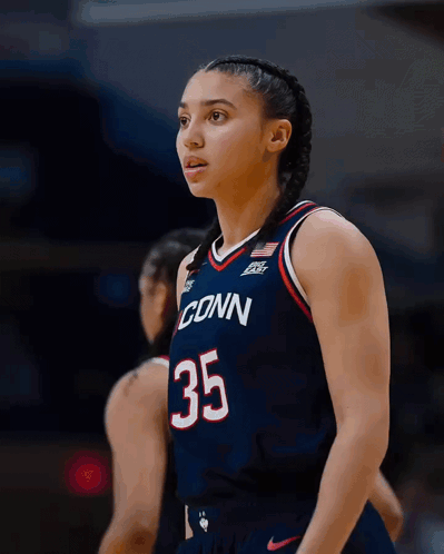 A Female Basketball Player Wearing A Jersey That Says Conn 35 GIF