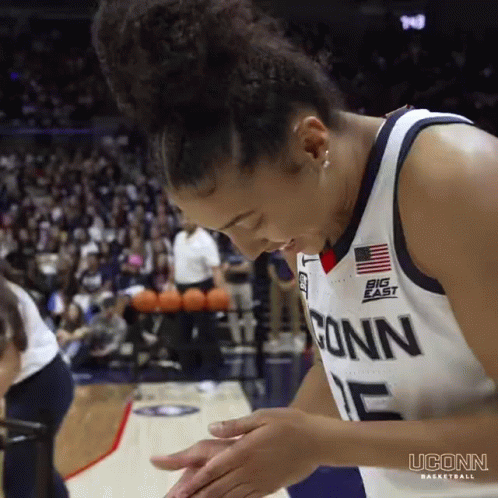 A Female Basketball Player Wearing A Jersey That Says Conn On It GIF