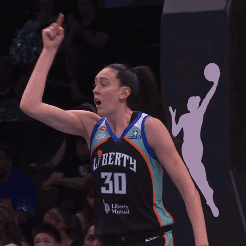 A Female Basketball Player Wearing A Jersey That Says Liberty 30 GIF