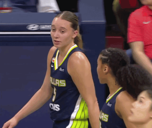 A Female Basketball Player Wearing A Jersey That Says Ovs On The Front GIF
