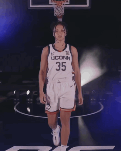 A Female Basketball Player Wearing A Jersey With The Number 33 On It GIF