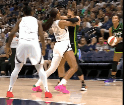 A Female Basketball Player Wearing A Number 22 Jersey GIF